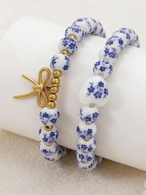 Anthropologie White and Blue Porcelain Bead Bracelet with Gold Bow